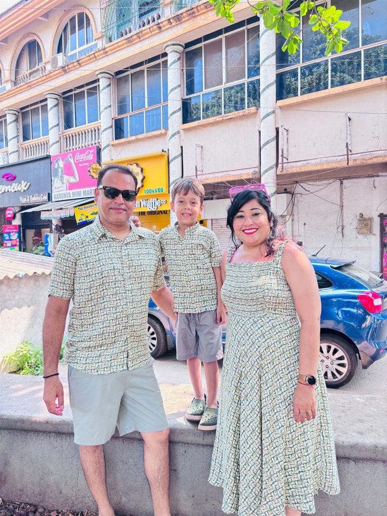 Family in matching green printed outfits